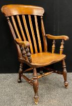 A 19th century Elm and Beech Lathe back armchair, 102cm high x 69cm wide x 60cm deep.