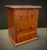 Miniature Furniture - an early 20th century chest of two short and two long drawers