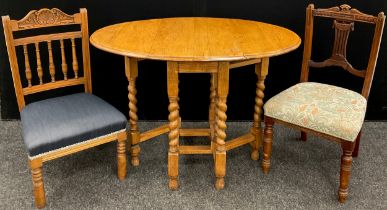 A late Victorian oak drop-leaf table, oval top, barley-twist supports, 73cm high x 76.5cm x 40cm (