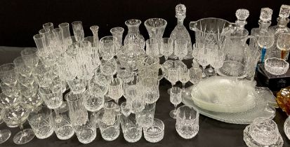 A quantity of glassware including; a pair of cut glass decanters, Stuart crystal glass bowl, a set