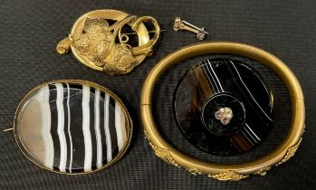 A Victorian seed pearl and amethyst set rolled gold hinge bangle, banded agate shield brooch,