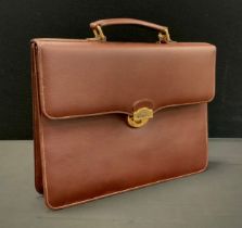 Burberry brown leather briefcase, interlined Burberry material, fitted interior with pockets and