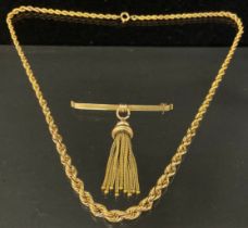 A graduated rope twist necklace, stamped 585, 40cm long, 8.8g; a yellow metal fringe fob tie pin,