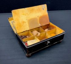 A 19th century blackened tin six section spice box, with remnants of contents the named sections inc