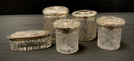 A Victorian/Edwardian matched silver mounted hobnail cut glass part dressing table set, hair tidy,