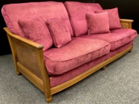 An Elm and Bergere weave deep sofa, plum upholstery cushions, approx. 89cm high x 191cm wide x 102cm