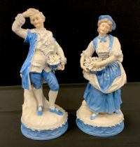 A pair of Dresden porcelain figures, possibly Johansen Roth, modelled as Flower Girl and Dandy, each