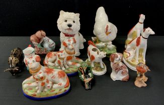 Figures including; Shelby shepherd figure with his dog, 12cm high, Staffordshire style spaniels; etc