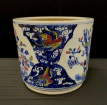 A Chinese porcelain planter decorated with exotic birds, 29cm high