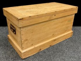 A pine tool chest, lift-up lid, with iron strap hinges, enclosing a pair of sliding removable