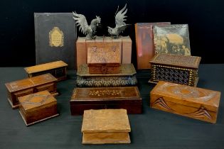 A rectangular carved and studded wooden jewellery box; others, inlaid with acorns and branches,