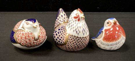Royal Crown Derby paperweights including; ‘ Hen’,’ Sitting Partridge', 'Anniversary Robin’, all gold