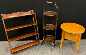 A mahogany three tier wall shelf, 75cm high x 56cm wide; an Edwardian collapsible three tier cake