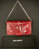 A Dolce & Gabbana red leather crocodile skin effect handbag, chain link shoulder strap, pink lined