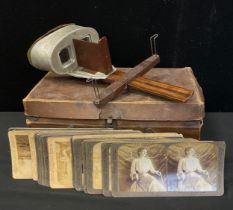 A hand held Stereoscopic Viewer and approx 26 assorted cards qty