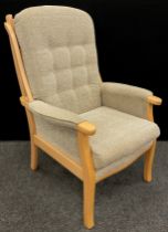 A contemporary beechwood ‘Easy’ armchair, 107cm high x 75cm wide.