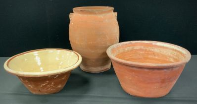 A 19th century terracotta Pancheon bowl, 39.5cm dimeter, another slip glazed; etc (3)