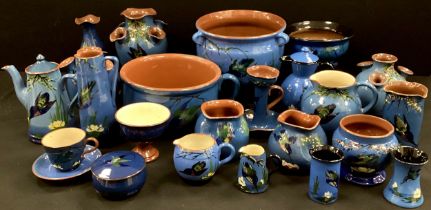 A quantity of Torquay ware hand painted with Kingfishers on blue ground including, chamber pot,