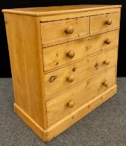 A pine chest of two over three graduated long drawers, 101cm high x 102cm wide x 52.5cm deep.