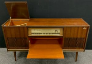 A retro walnut stereo cabinet, with integrated Grundig Stereo turntable, and Grundig Senderwahl