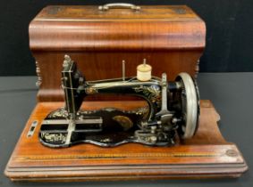 A Iodhlann hand crank sewing machine, reg no.21214656, c.1910