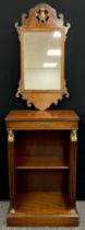 A small Egyptian revival mahogany bookcase, with reeded faux pilaster supports, applied with gilt