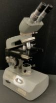 A Kyowa compound binocular microscope, no. 764949.