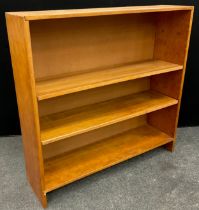 A pine open bookcase, three tiers of deep shelving, 112cm high x 114.5cm wide x 30.5cm deep.