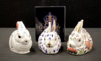 Royal Crown Derby paperweights including; ‘Meadow Rabbit’, ‘Bunny’, other, all gold stoppers (3)