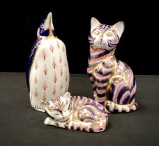 Royal Crown Derby paperweights including; ‘Sitting cat’, 13cm high, another sleeping, ‘Penguin’, all
