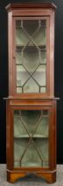 An Edwardian Sheraton revival, satinwood cross-banded, mahogany corner cabinet, the astral-glazed