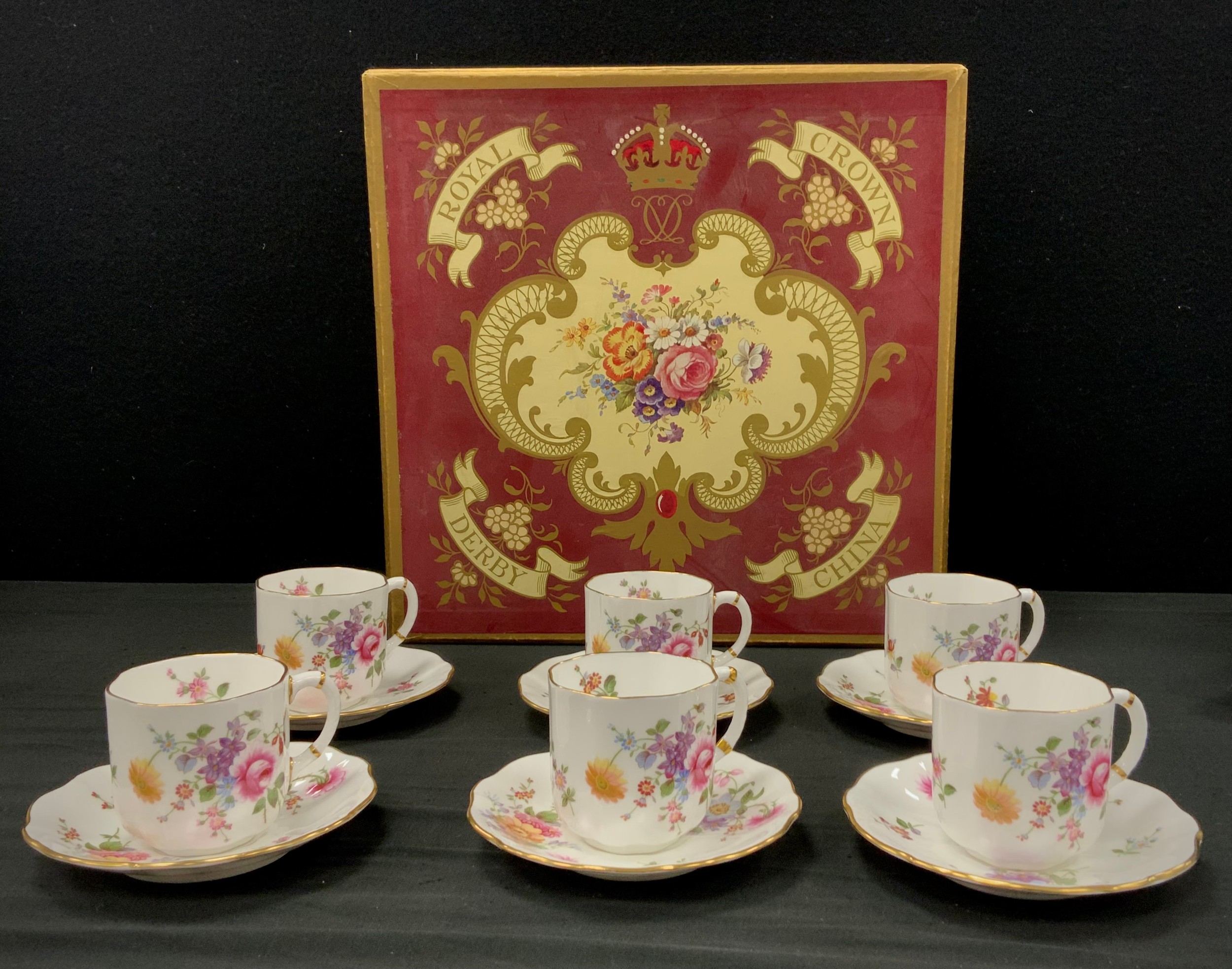 A set of six Royal Crown Derby ‘Derby Posies’ coffee cans and saucers, first quality, boxed