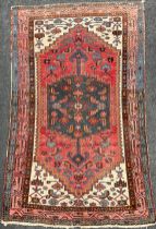 A Persian, Hamadan style rug, hand-knotted in tones of red, blue, burgundy, and cream, 200cm x