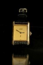 A Must De Cartier silver gilt tank cased ladies quartz wristwatch, signed cream coloured dial, black