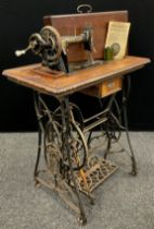 A Frister & Rossmann Lockstitch sewing machine, with cast iron treadle base, number 1288422, c.1910.