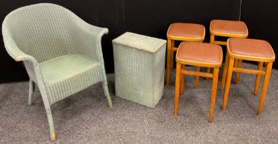 A Lloyd Loom ‘Lusty’ bedroom tub chair, and a conforming small laundry basket; and a set of four mid