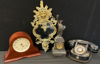 A Statue of Liberty figural mantel clock, cream dial, bell telephone , brass framed mirror etc.