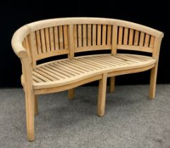 Garden furniture - a teak ‘Half-moon’ shaped three seat garden bench, 85cm high x 159cm wide x