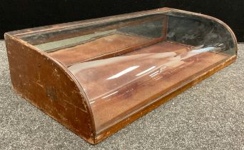 An early to mid 20th century table top bijouterie cabinet, shaped glazed top, with hinged fall