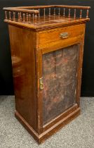 An Edwardian mahogany music cabinet, three-quarter galleried top, above a single drawer to frieze,