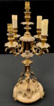 A gilt metal five light table lamp, as a candelabra, with central taller light, surrounded by four