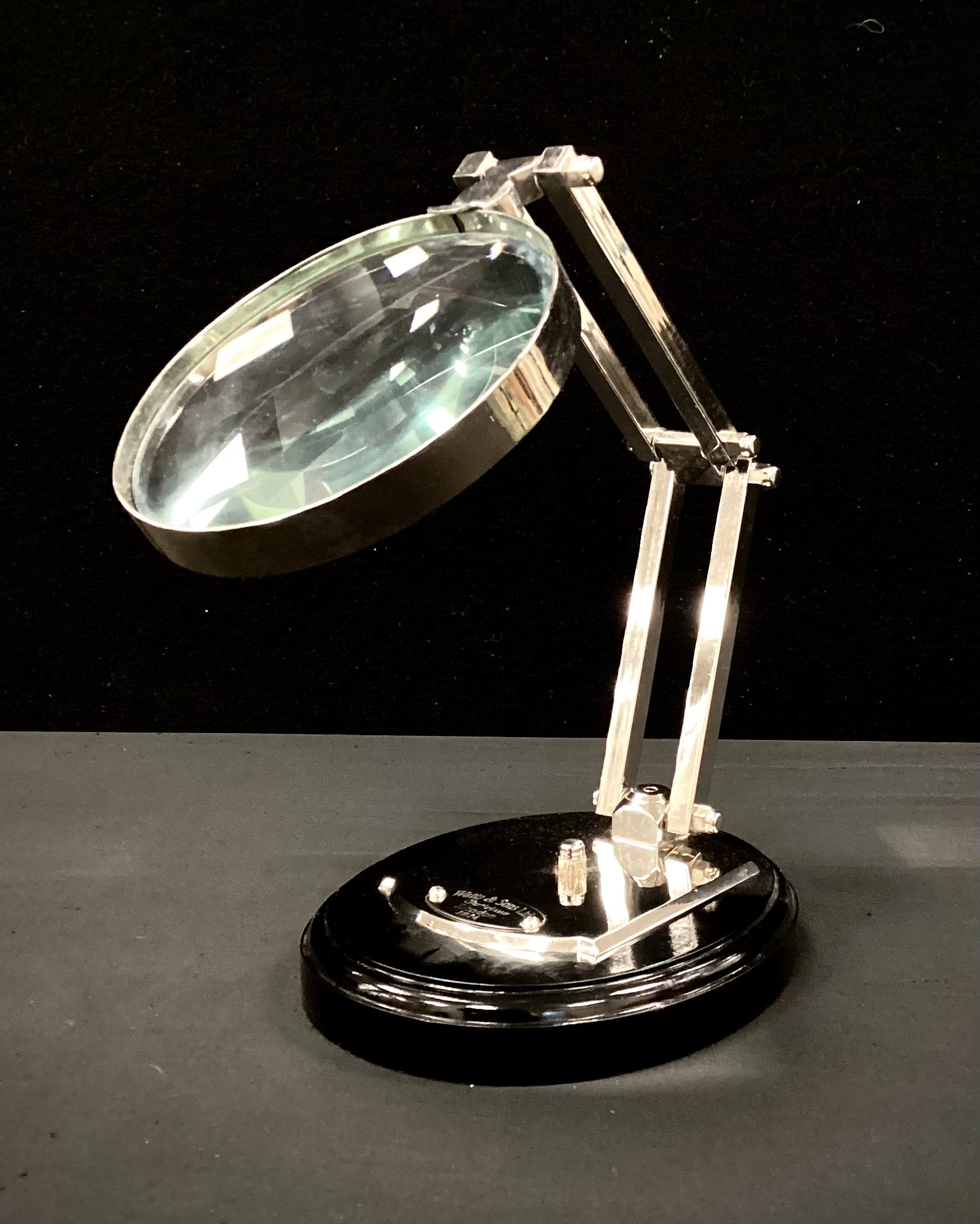 A Chrome magnifier on stand, 24cm high