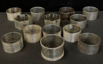 A set of six Walker and Hall silver napkin rings, Sheffield 1944; others assorted , approx.320.8g (