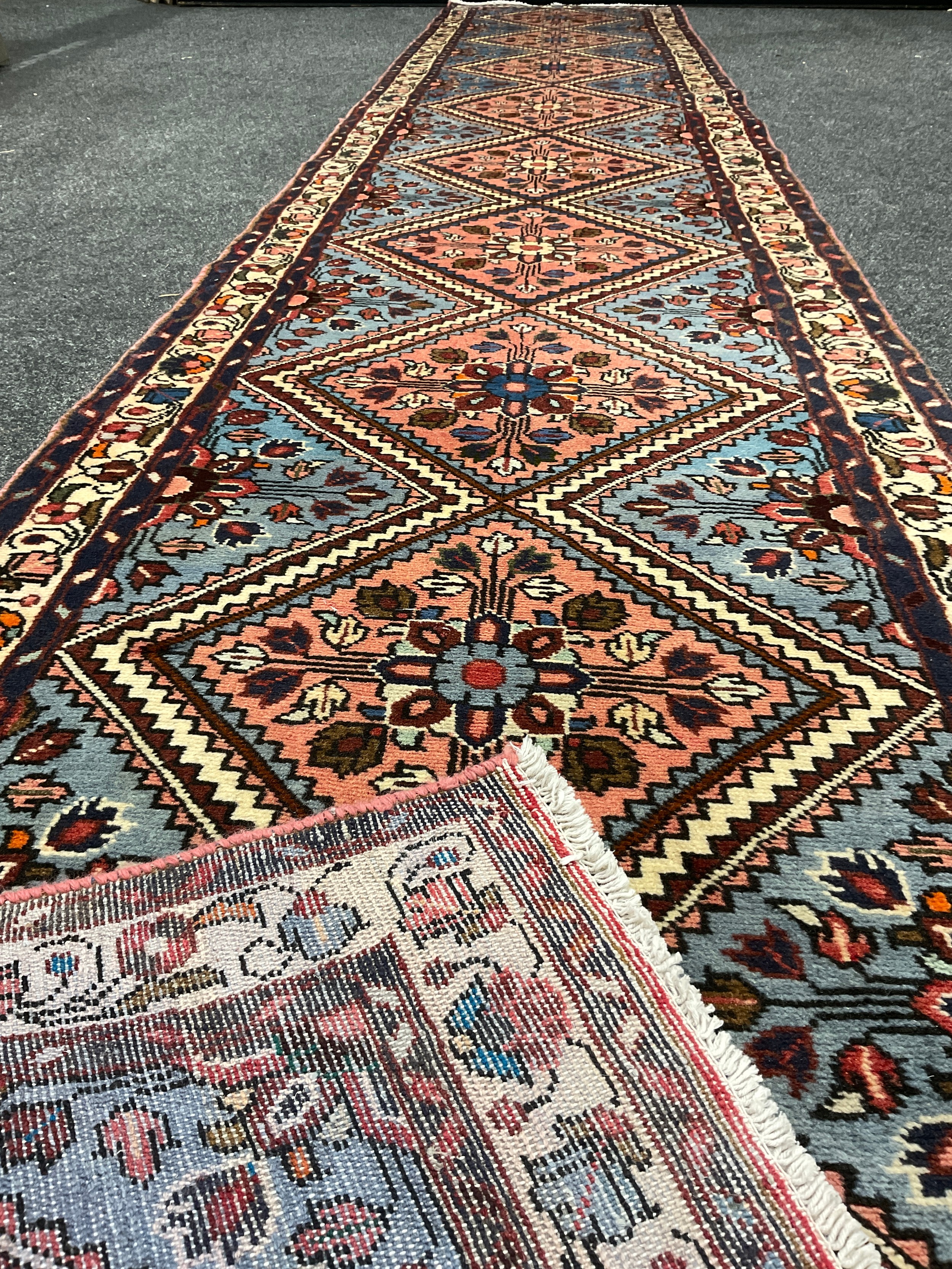 A North West Persian Rudbar Runner carpet, hand-knotted with a row of nine diamond-shaped - Image 3 of 3