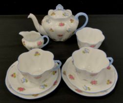 A Shelley 'Rose Pansy Forget me not' tea service for two comprised of; a tea pot, milk jug, sugar