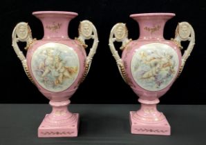 A pair of Sevres style pink cherub vases, twin handled, decorated with printed cherubs on pink