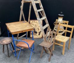 A mid 20th century child’s school desk and chair; a pair of beech school chairs; German ‘lava’ glaze