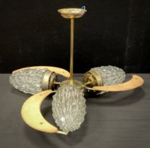 A mid century teak and brass ceiling light, 32cm high