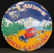 A reproduction enamel Shell Gasoline sign, 29cm dia