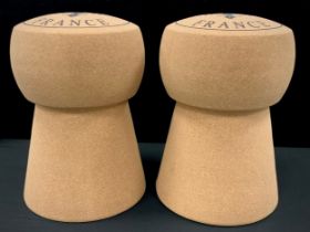 A pair of enlarged champagne cork stools, 50cm high (2)